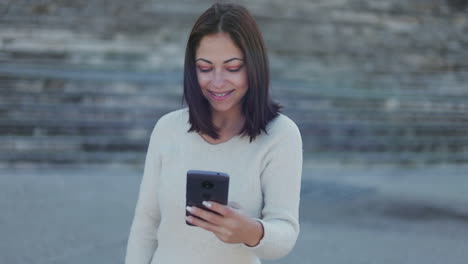 Happy-young-woman-having-video-call-through-smartphone